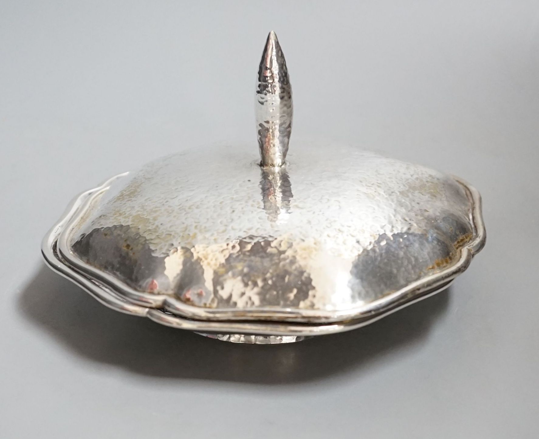 An Austro-Hungarian planished white metal dish and cover, 17.2cm, 16oz.